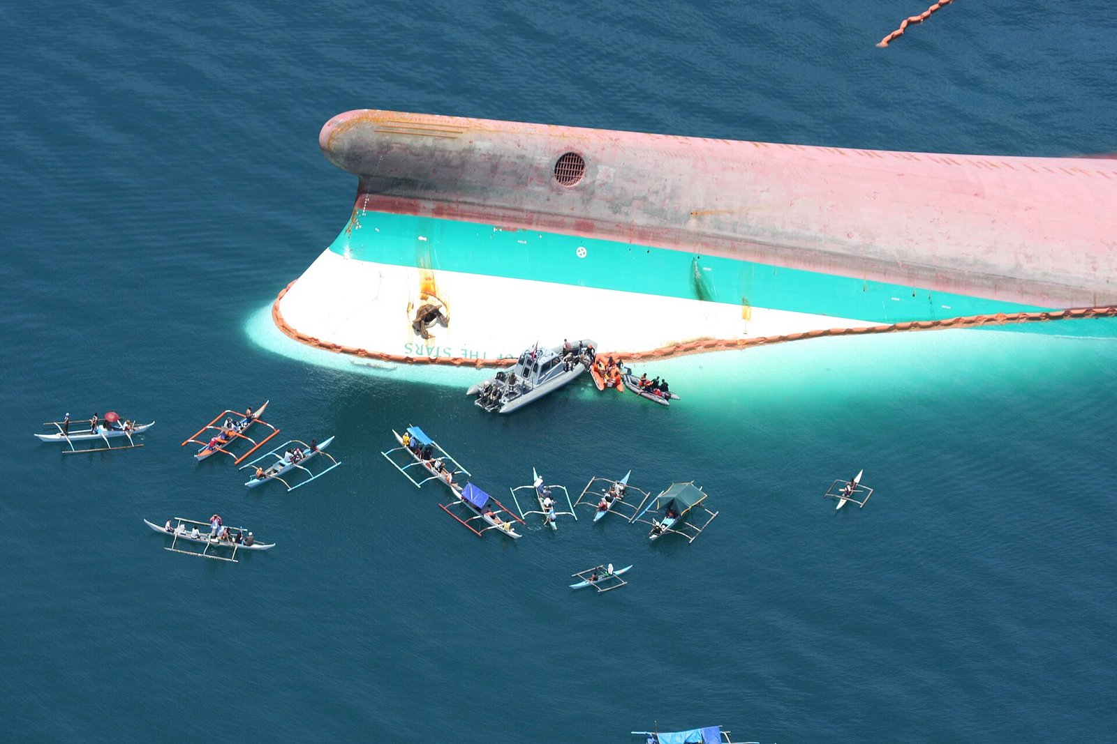A rigid-hull, inflatable boat from Maritime Prepositioning Ship USNS GYSGT Fred W. Stockham helps search for survivors of the capsized commercial passenger ferry MV Princess of the Stars June 25. The ferry capsized during Typhoon Fengshen in the Philippines.
